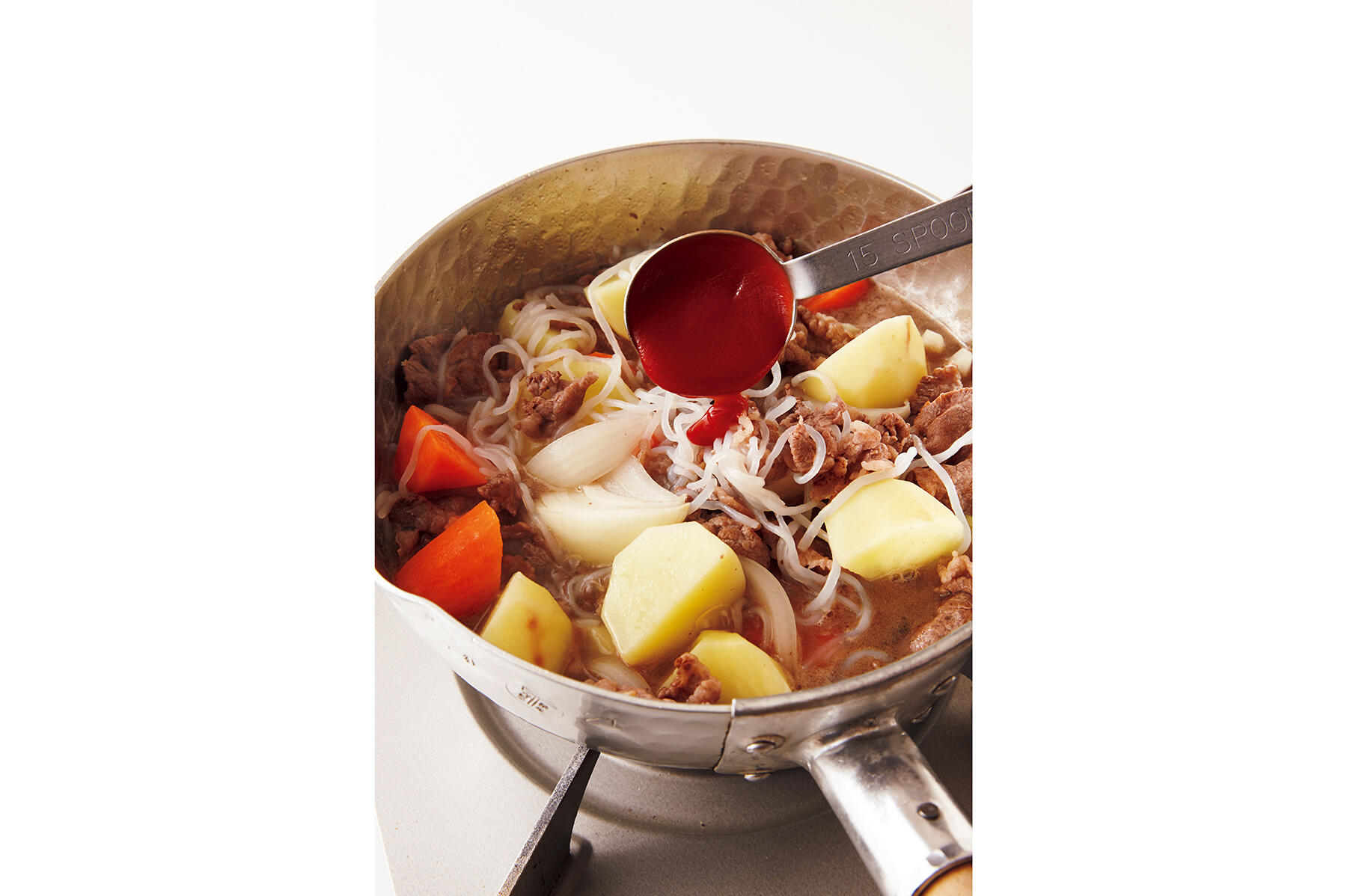 醤油といんげんを加え、仕上げる